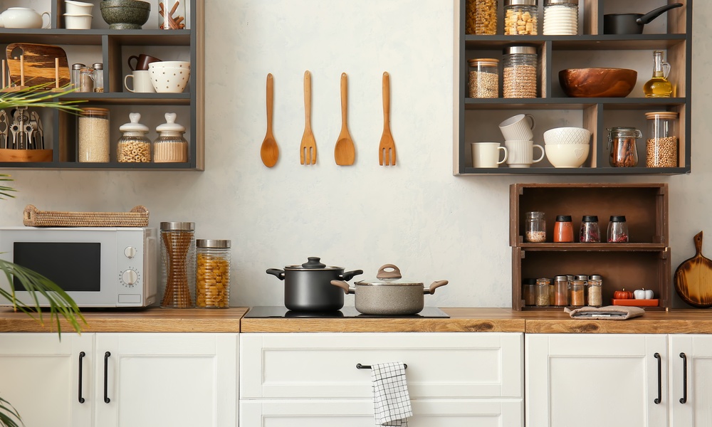 A well-organized kitchen with tidy shelves, clutter-free counterspace, and other storage solutions.